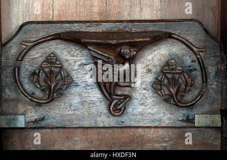 A misericord in St. Nicholas, St. Mary and St. Thomas`s Church, Blakeney, Norfolk, England, UK Stock Photo